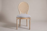 Este dining chair, straight front view: oval cane-look back, light grey seat, four fluted legs