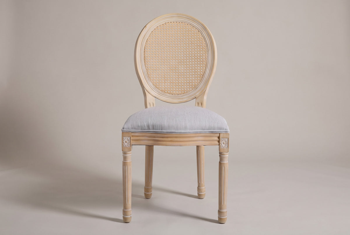 Este dining chair, straight front view: oval cane-look back, light grey seat, four fluted legs