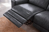 Looking down on the open Esther recliner in Aged Slate: the one-piece footrest out in three padded stages over a jute rug, the seat beside it closed. Shown in Aged Slate, Right chaise.