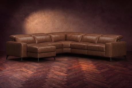 The Esther sectional in Burnished Chestnut distressed full leather on a dark herringbone floor, headrests down and footrest closed. Shown in Burnished Chestnut, Left chaise.