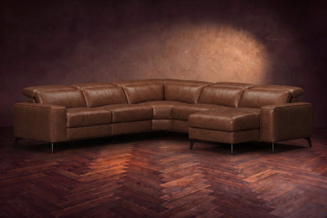 The Esther sectional in Burnished Chestnut distressed full leather on a dark herringbone floor, headrests down and footrest closed. Shown in Burnished Chestnut, Right chaise.