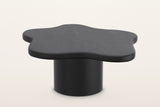 Exilles large cloud coffee table in black, 35.5 in across on one round drum, on a warm white studio backdrop