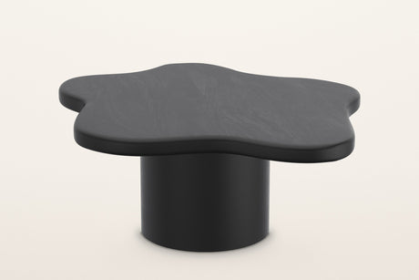 Exilles large cloud coffee table in black, 35.5 in across on one round drum, on a warm white studio backdrop