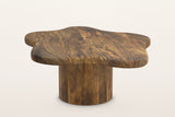 Exilles large cloud coffee table in walnut-stained mango wood on a staved round drum, on a warm white studio backdrop