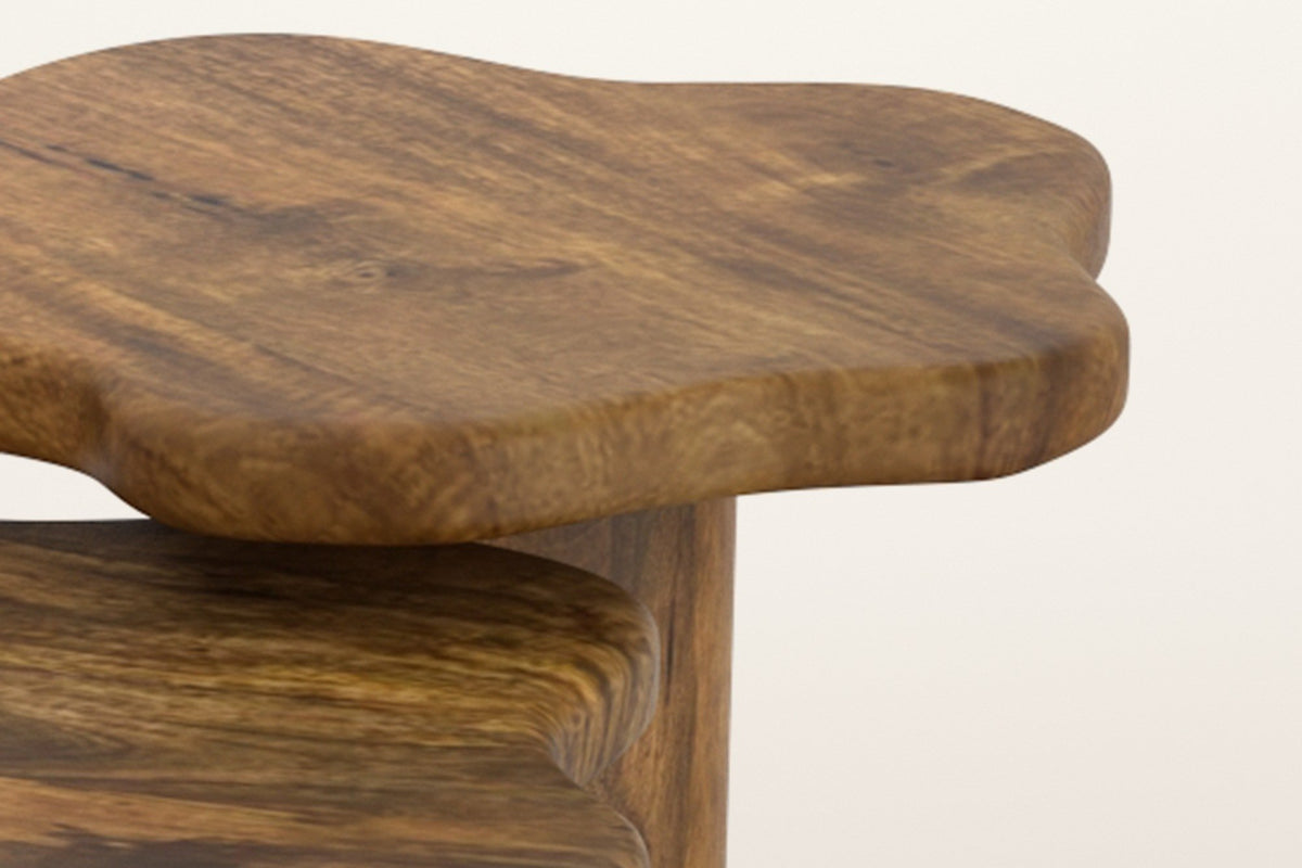 Close-up of the Exilles tops in walnut-stained mango: the thick rounded edge of the small top over the large one
