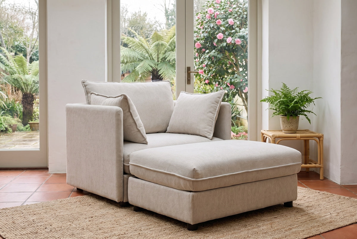 Faenza ottoman pushed against the chair to make a lounger, in a Victoria garden room with glass doors onto the garden