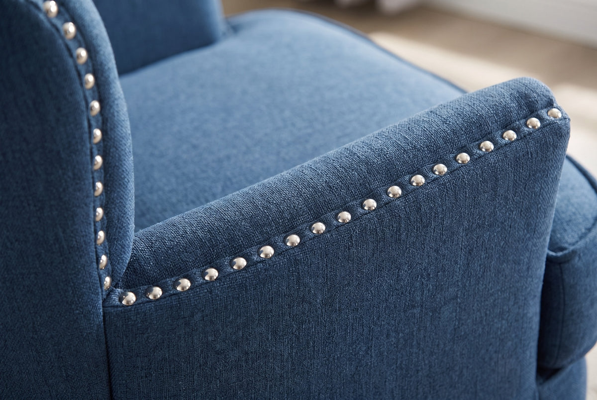 Close-up of the Feltre arm with its row of silver nailheads in navy woven fabric