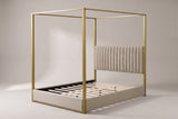 Fermo canopy bed in beige and gold, three-quarter view on a warm grey studio backdrop