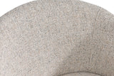Close-up of the Finley chair's curved back in flecked sand fabric