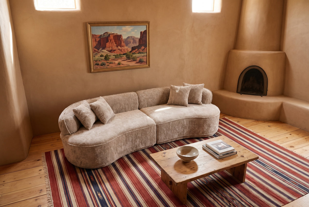 The Fiora sofa in Camel in an adobe house in Abiquiu, New Mexico, beside a kiva fireplace
