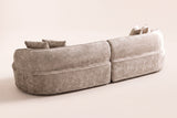 The Fiora curved sofa in Camel from behind
