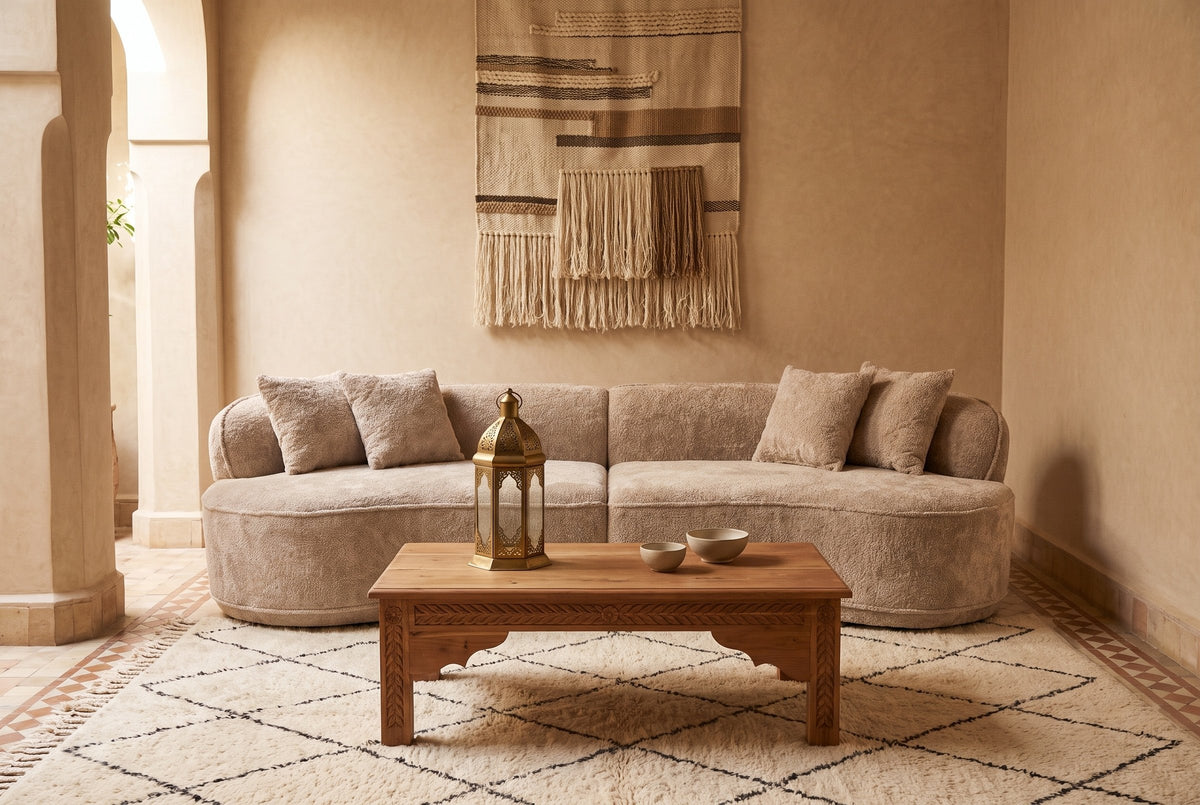 The Fiora sofa in Camel in a riad in Essaouira with tadelakt walls and a Beni Ourain rug