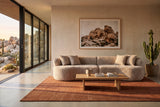 The Fiora sofa in Camel in a modernist desert house near Joshua Tree with a rust rug