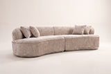 The Fiora curved sofa in Camel from a low front angle