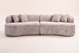 The Fiora curved sofa in Camel seen straight on