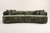 The Fiora curved sofa in Green seen straight on