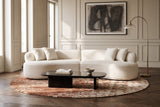 The Fiora sofa in White in an Art Deco apartment in Brussels, with chevron parquet and a black lacquered coffee table