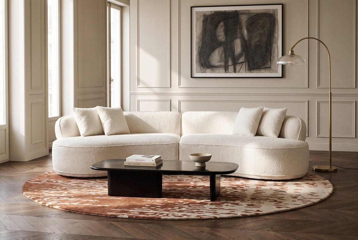 The Fiora sofa in White in an Art Deco apartment in Brussels, with chevron parquet and a black lacquered coffee table