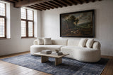 The Fiora sofa in White in a 17th-century Mechelen townhouse with dark oak beams and an indigo Oriental rug