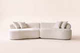 The Fiora curved sofa in White seen straight on, showing its curve and the two pieces