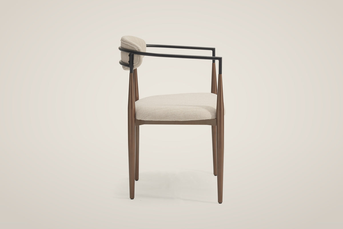 Fiuggi dining chair from the side: the two black arm tubes and the four tapered bronze legs