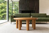 Low front view of the Fontanellato coffee table in Natural Oak in a Cambridge house, with a weathered steel fireplace wall