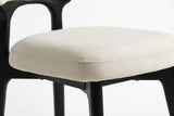 Close-up of the Fosdinovo thick cream seat cushion with its stitched edge seam above the black wood seat frame and leg