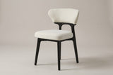Fosdinovo dining chair with a black-stained wood frame and cream upholstery