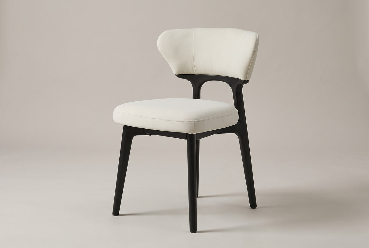 Fosdinovo dining chair with a black-stained wood frame and cream upholstery