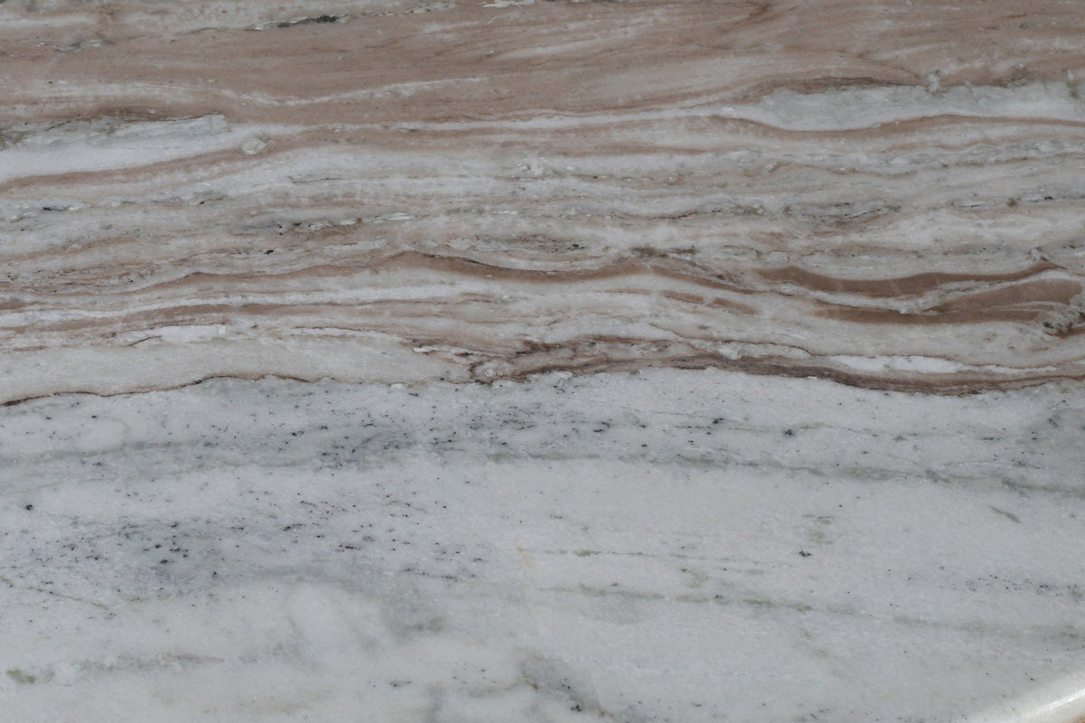 Close-up of the Frascati table top: Fantasy Brown marble in flowing bands of cream, grey and taupe