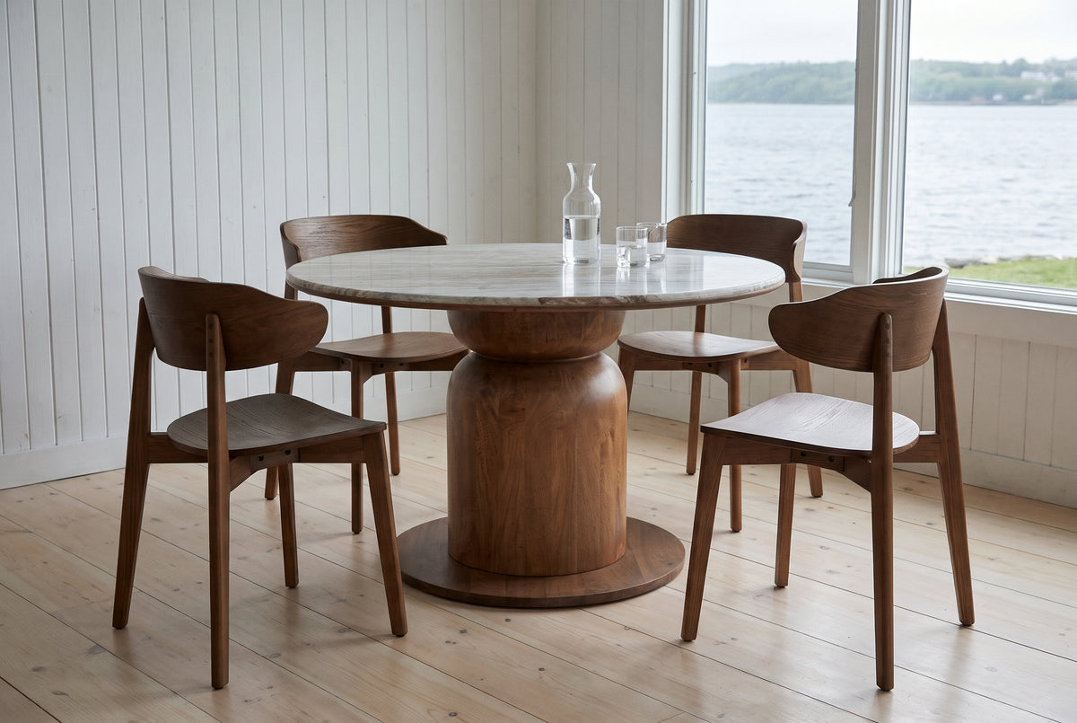 Frascati dining set with four walnut wood chairs in a Halifax harbour-front house, the harbour beyond the window