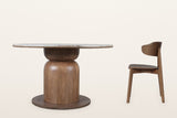 Frascati table and one wood chair, side view: the bowl and column of the pedestal on its flat round plinth