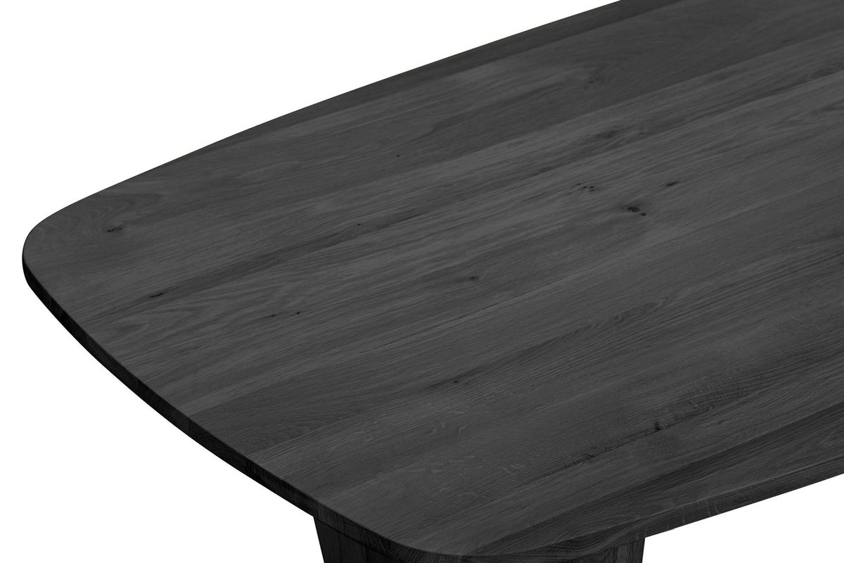 Close-up of the Frontino top in Black: a large rounded corner with the oak grain showing through the black finish