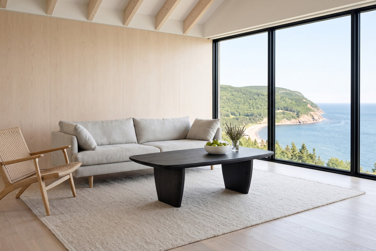 Frontino coffee table in Black before a stone-grey linen sofa in an Ingonish cliff house on Cape Breton Island