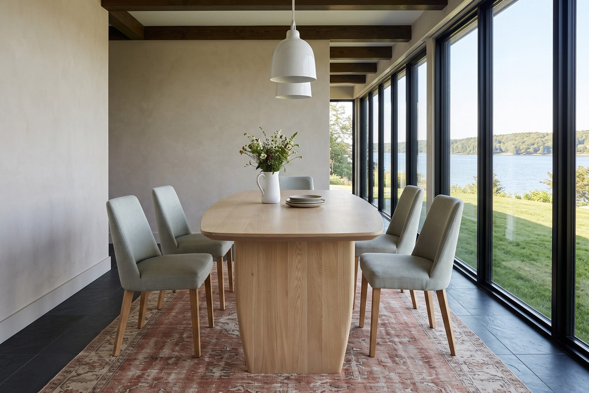 End view of the Frontino dining table in Biscotti Oak in a Halifax house on the Northwest Arm, with limewashed walls