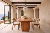 End view of the Frontino dining table in Honey Brown in a Cascais cliff-top villa, with lime-rendered walls