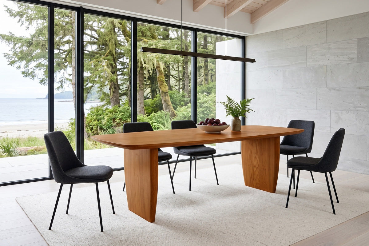 Frontino dining table in Honey Brown in a Haida Gwaii house, with a pale limestone wall, cedar rafters