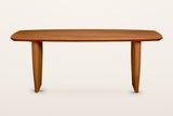 Frontino dining table in Honey Brown, straight front view on a warm white studio backdrop