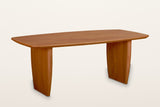 Frontino slab-leg oak dining table in Honey Brown, three-quarter view on a warm white studio backdrop