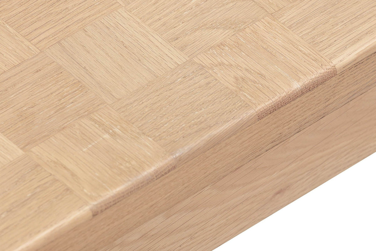 Close-up of the Furore edge in Biscotti Oak: the softly rounded top edge over the set-back apron