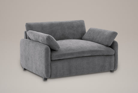 Gallipoli oversized chenille accent chair in charcoal gray, three-quarter view on a warm grey studio backdrop