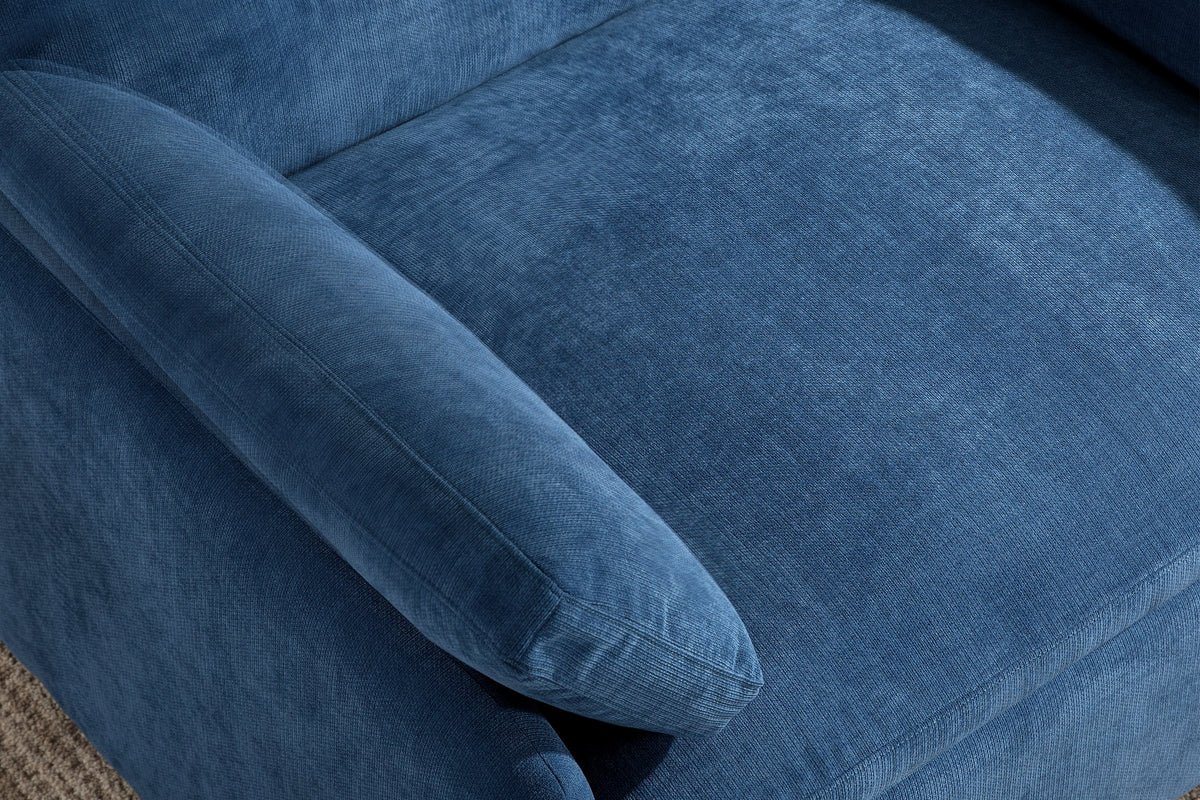 Close-up of the denim blue chenille seat cushion, a throw pillow and the rounded arm