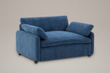 Gallipoli oversized chenille accent chair in denim blue, three-quarter view on a warm grey studio backdrop