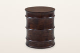 Gangi solid mango side table in Walnut, three-quarter view on a warm white studio backdrop: a round drum of four curved bands