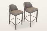 Two Gavi counter stools in brown side by side on a warm white studio backdrop: sold as a set of two