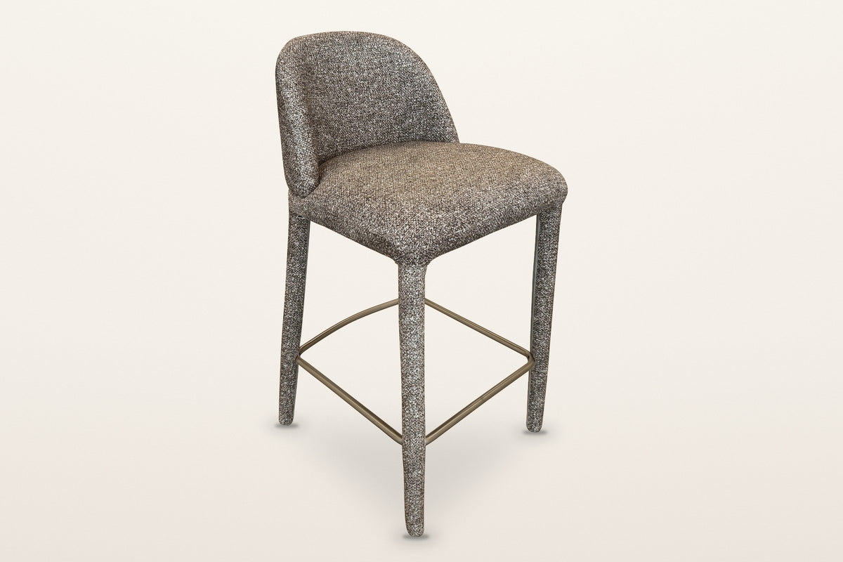 Gavi upholstered counter stool in brown, three-quarter view on a warm white studio backdrop