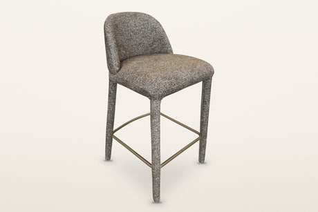 Gavi upholstered counter stool in brown, three-quarter view on a warm white studio backdrop