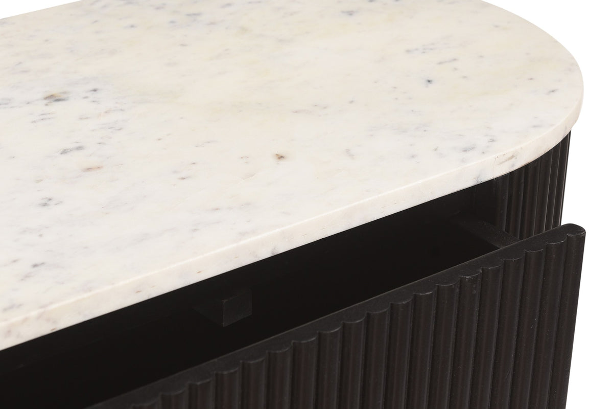 Close-up of the Gideon white marble top over a black reeded mango wood drawer
