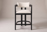 Gradisca horseshoe counter stool in Black with ivory boucle, straight front view on a studio backdrop