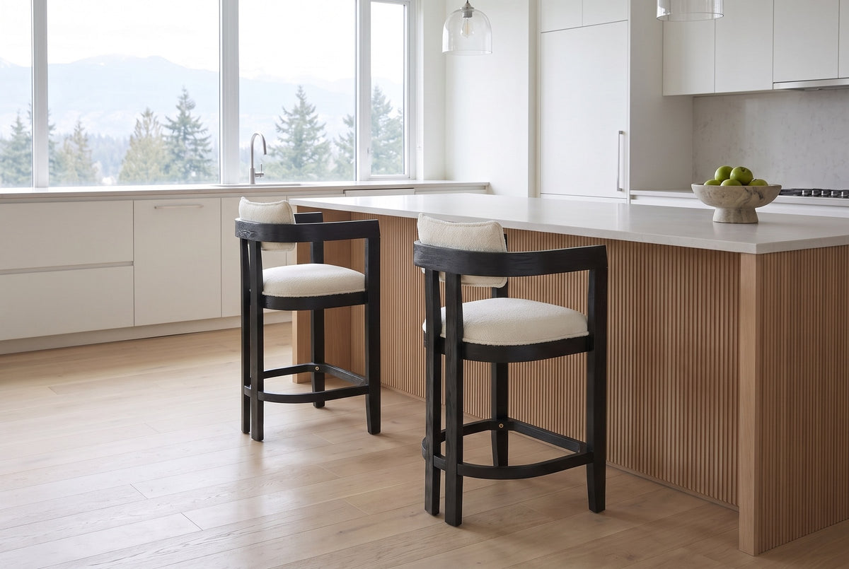 Two Gradisca counter stools in Black at a pale oak island in a bright Vancouver kitchen with mountain views